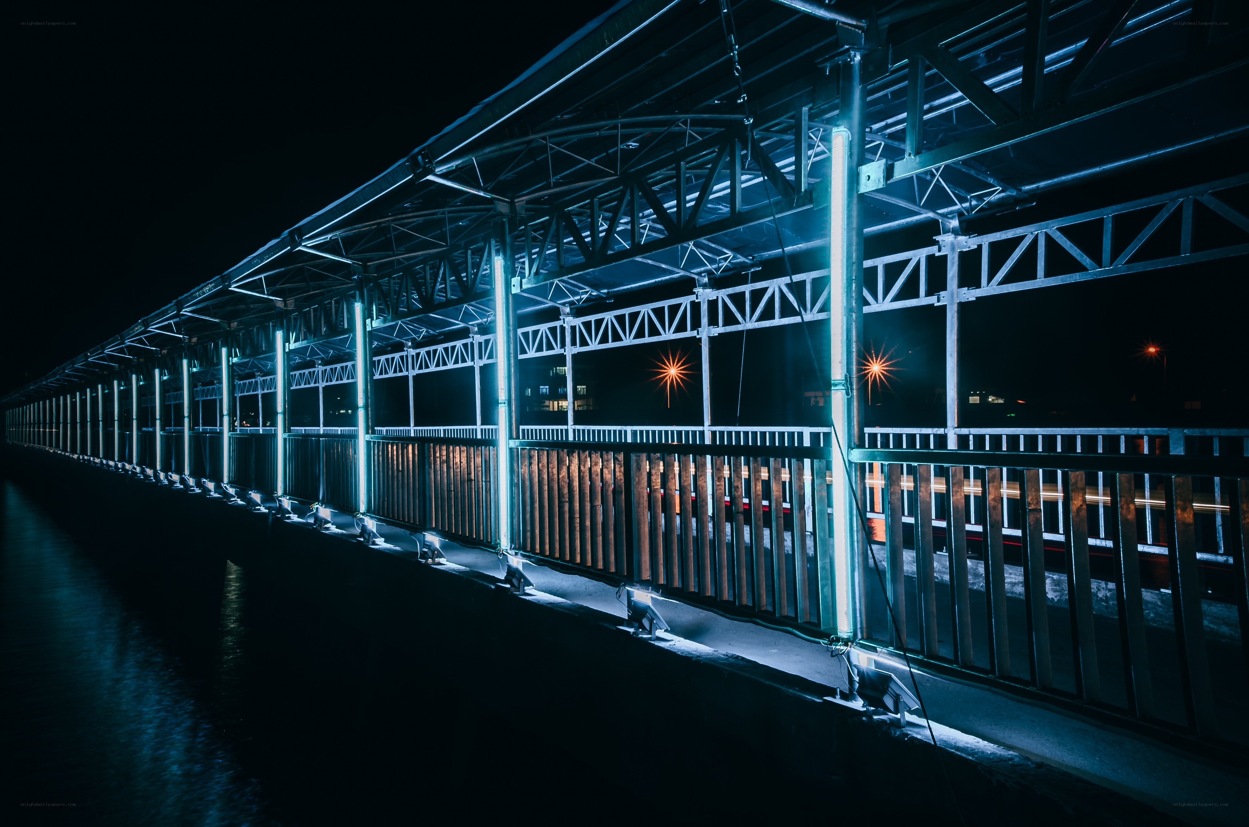 Nighttime bridge with blue lighting