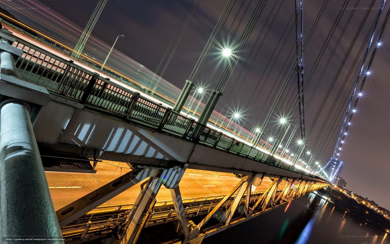 Nighttime bridge with light trails