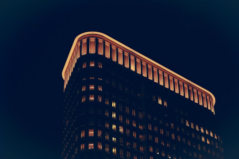 nighttime building with lit windows