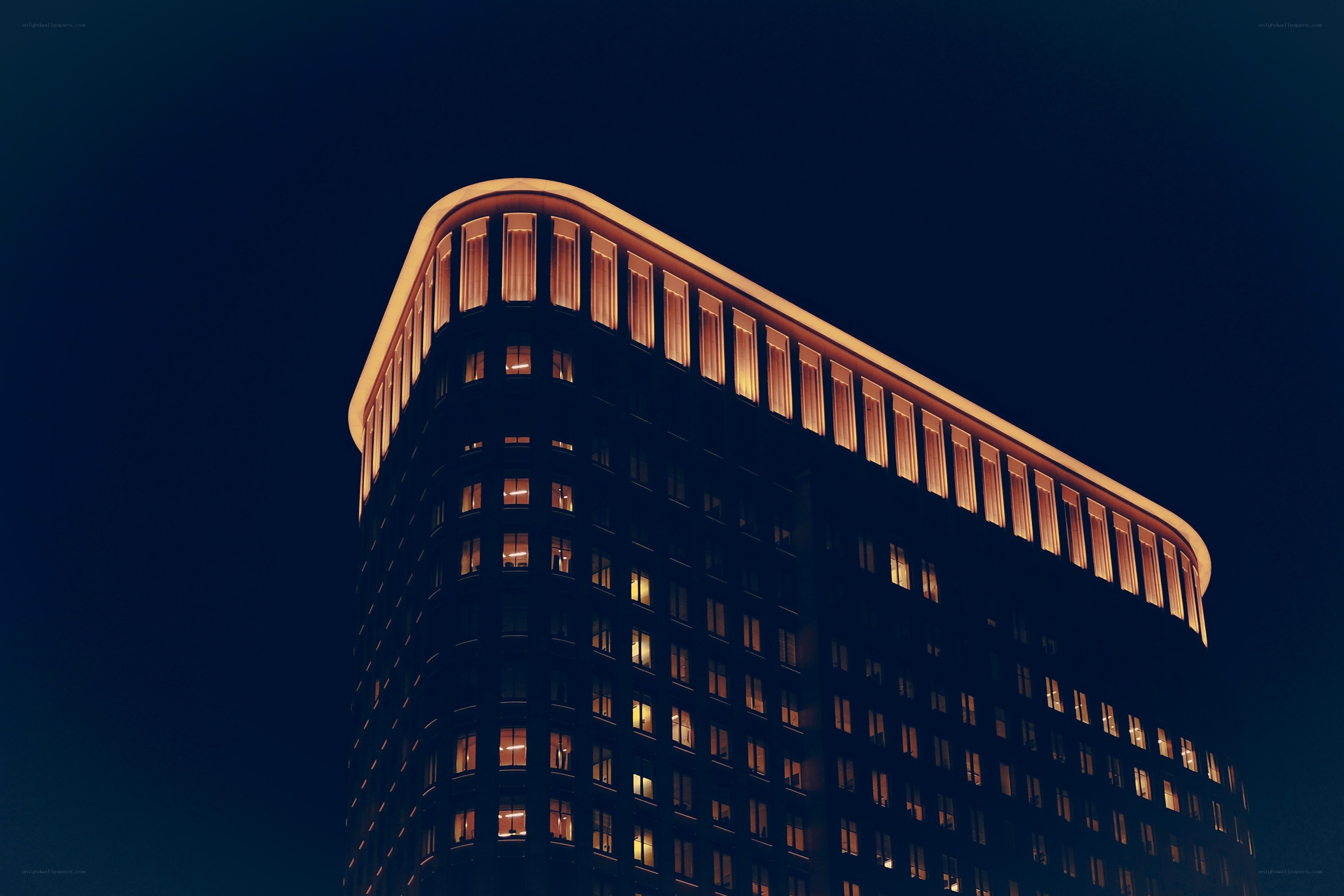 nighttime building with lit windows
