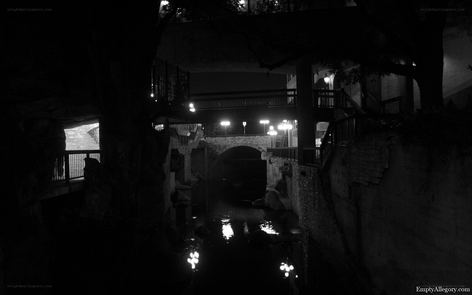 Nighttime canal under bridge