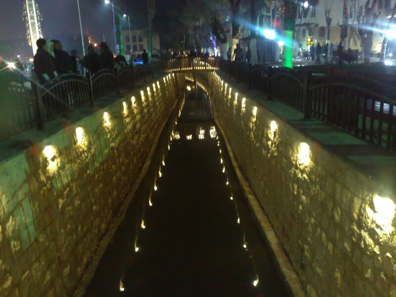 nighttime canal with lights