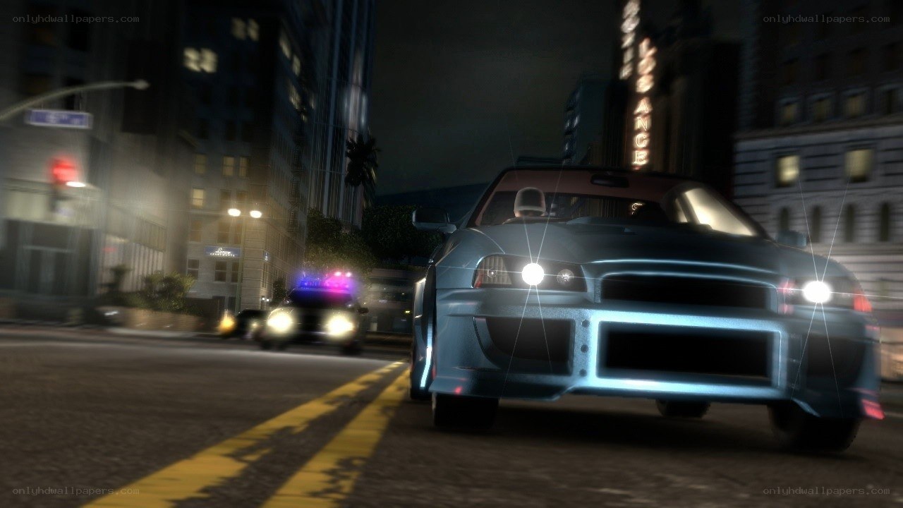 Nighttime car chase in city