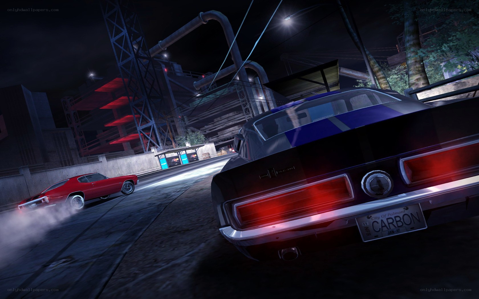 Nighttime car chase in industrial area
