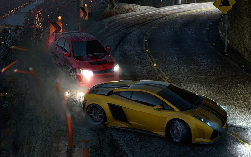 Nighttime car chase on winding road