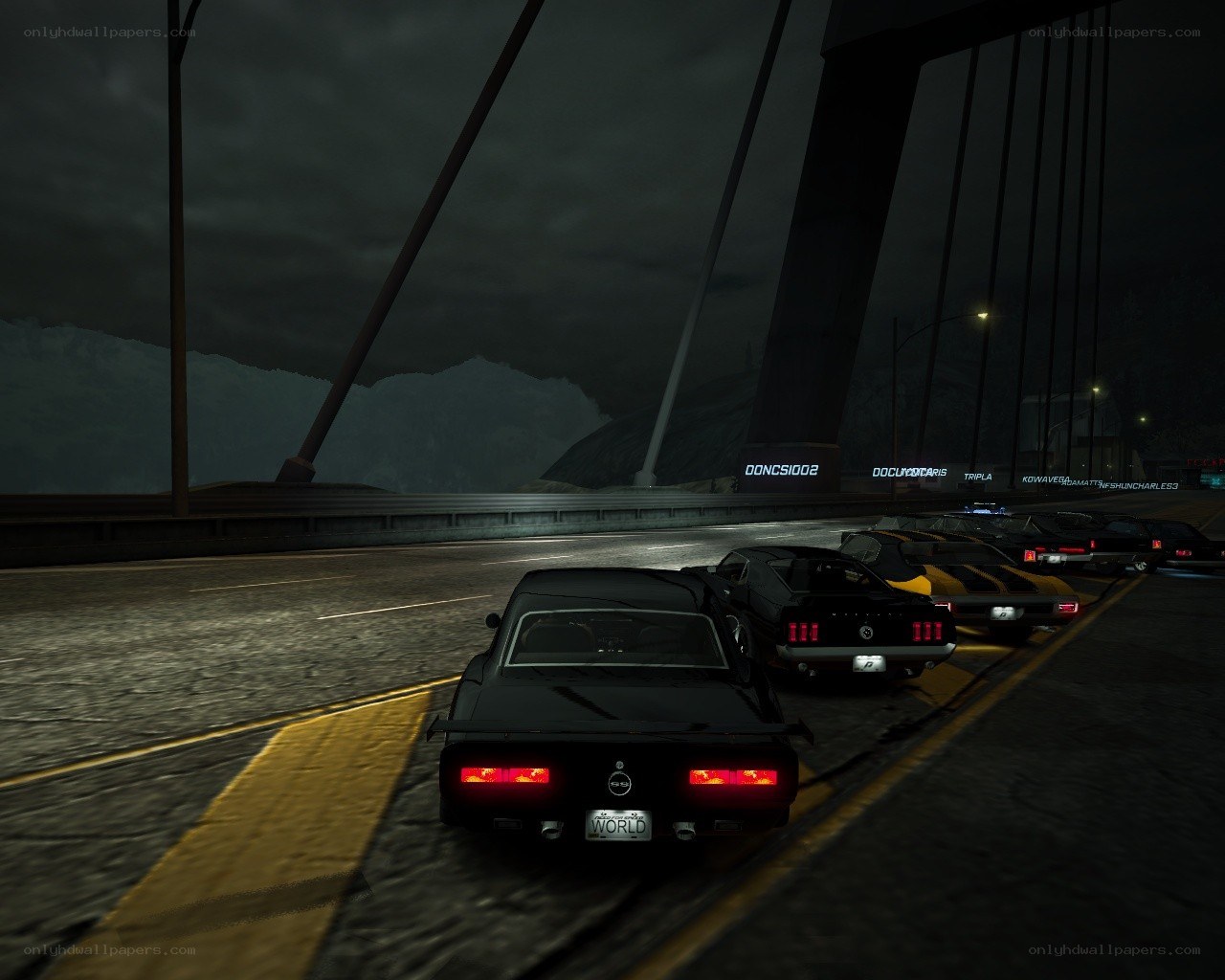 Nighttime car lineup on a bridge