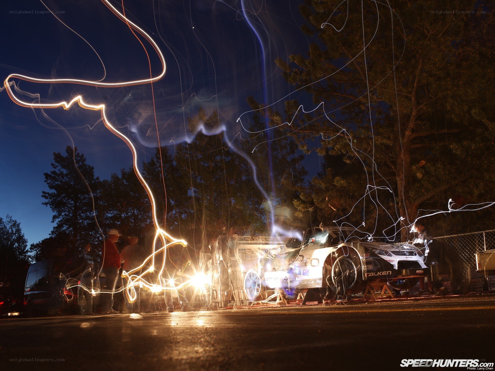 Nighttime car maintenance with light trails