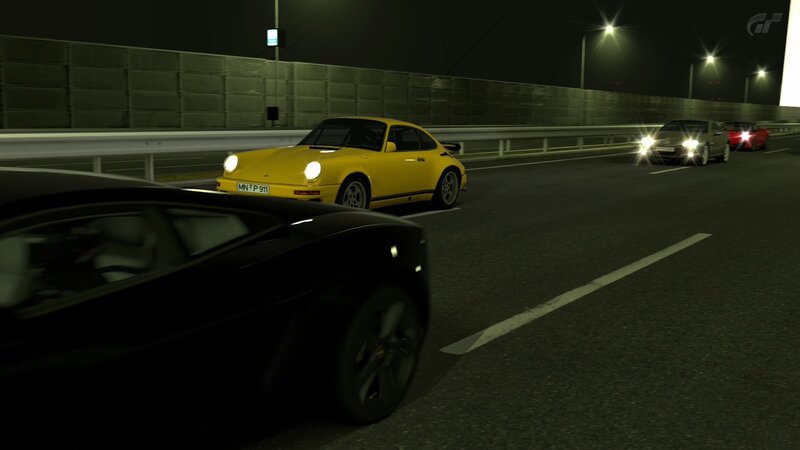 Nighttime car race on a bridge
