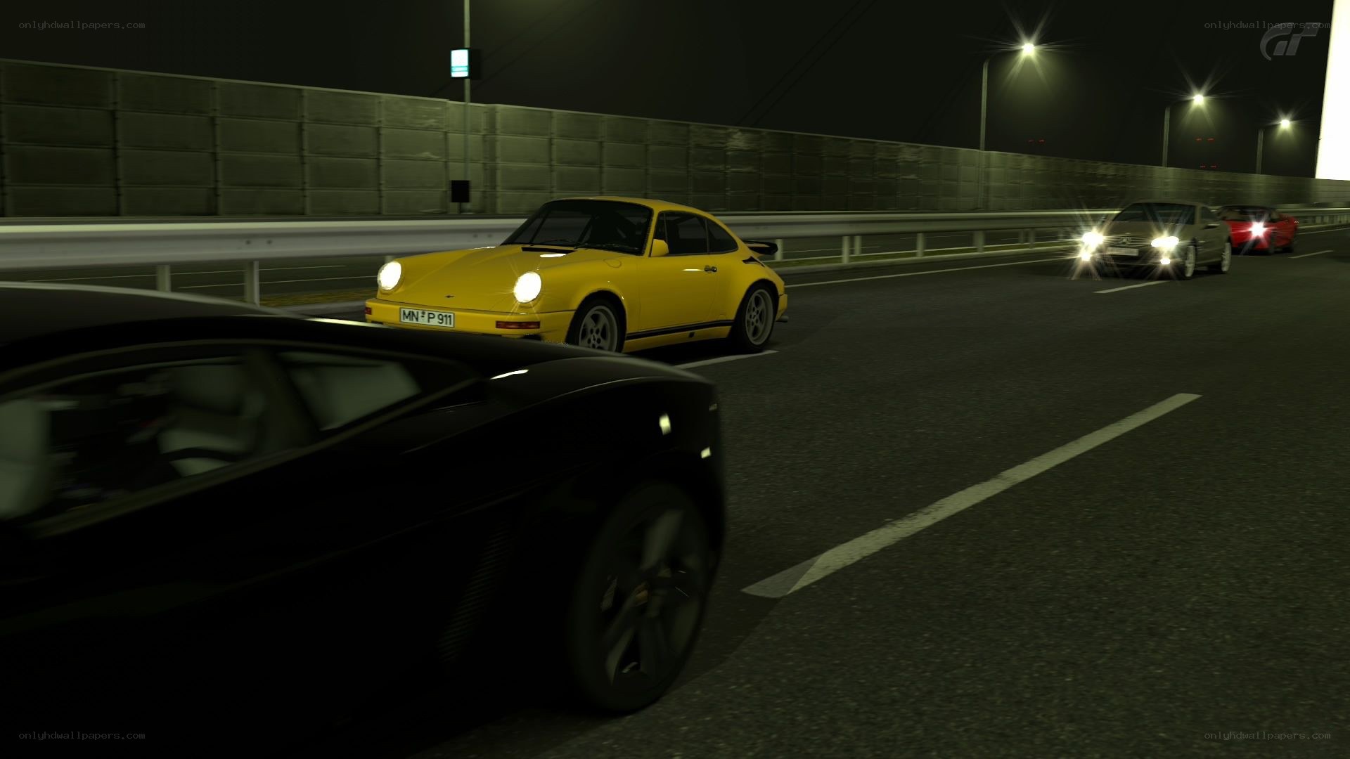 Nighttime car race on a bridge