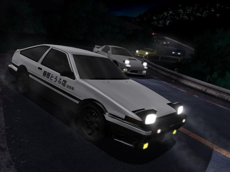Nighttime car race on a winding road