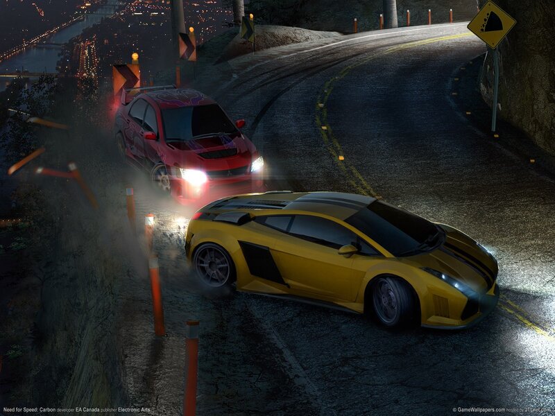 Nighttime car race on winding road