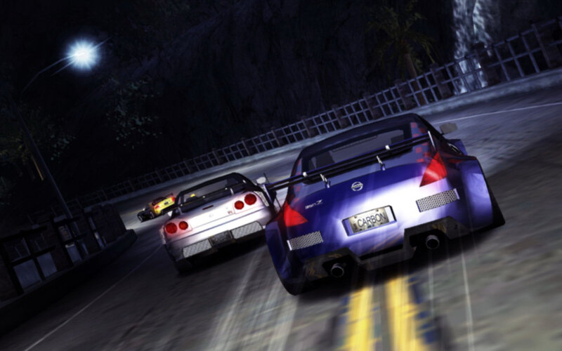 Nighttime car race on winding road