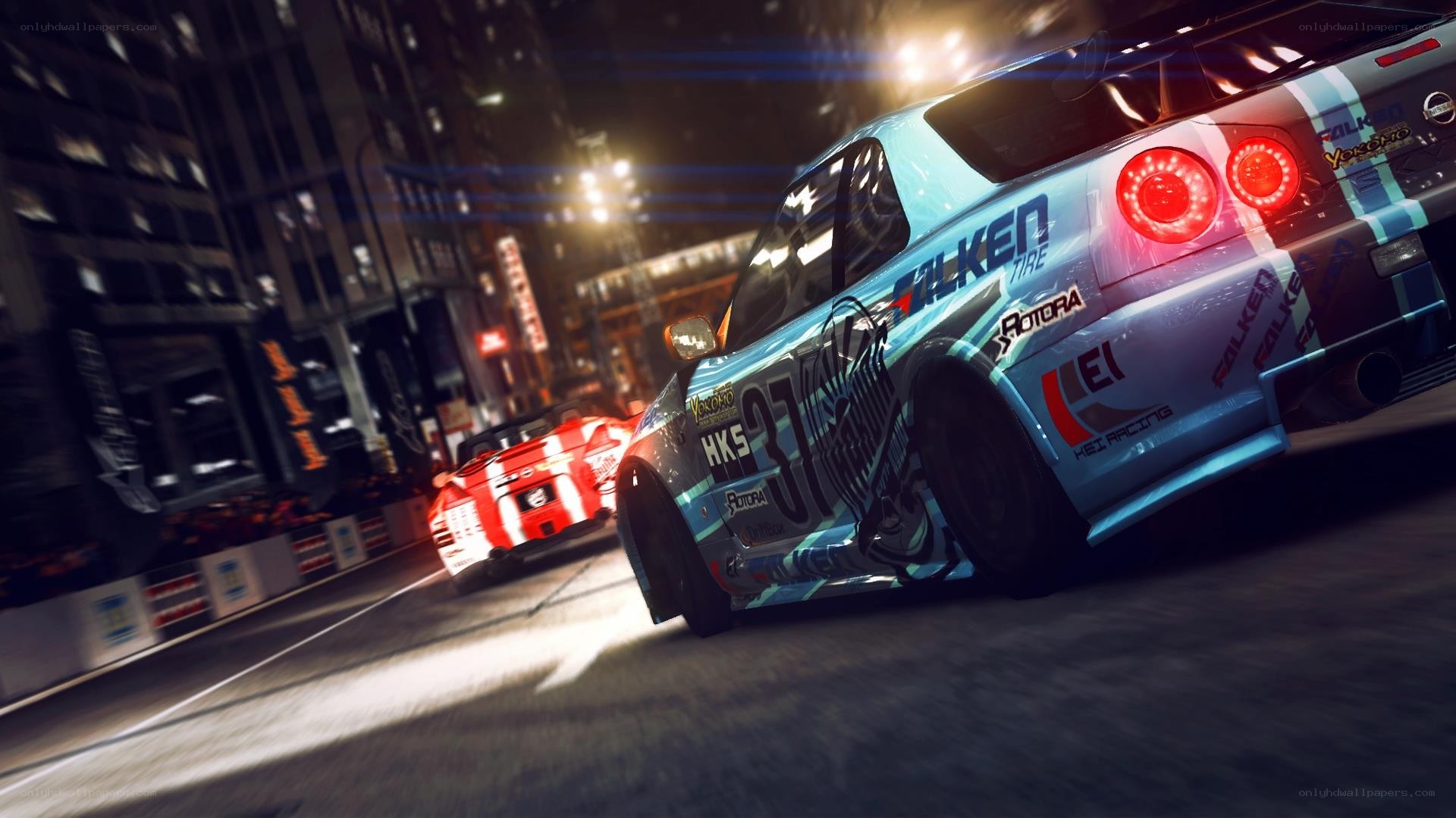 Nighttime car racing in city