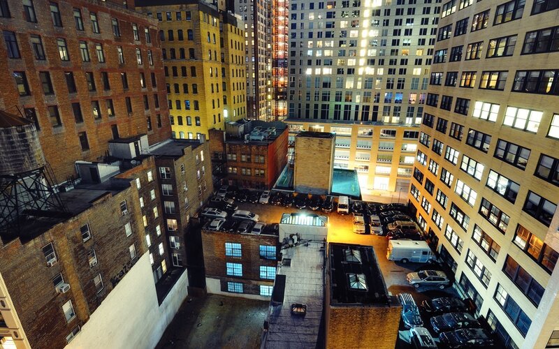 nighttime city alley between buildings