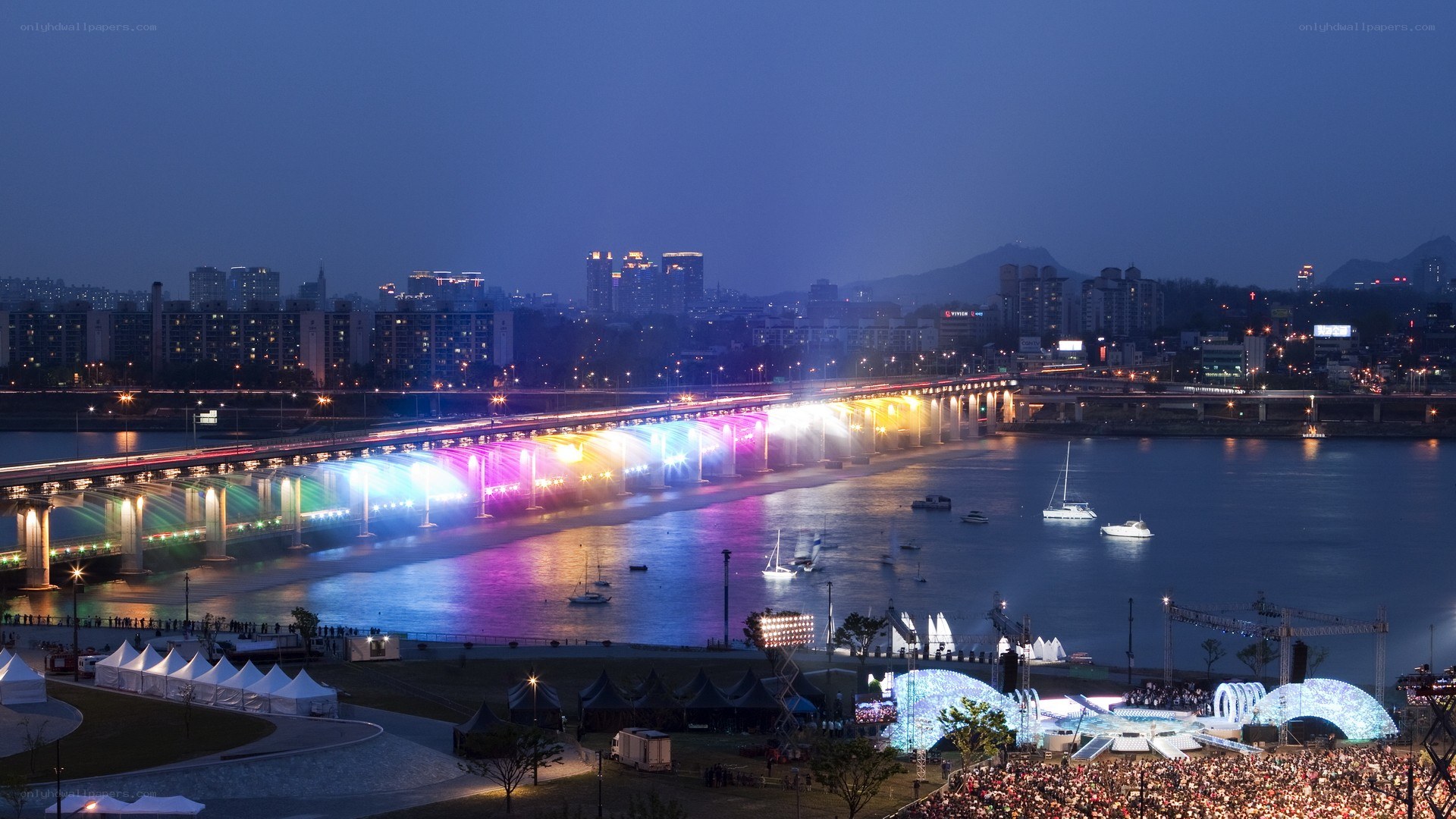 Nighttime city bridge light show