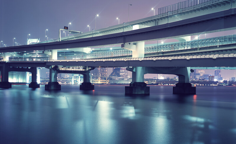 Nighttime city bridge scene