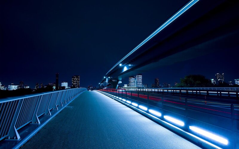 Nighttime city bridge scene