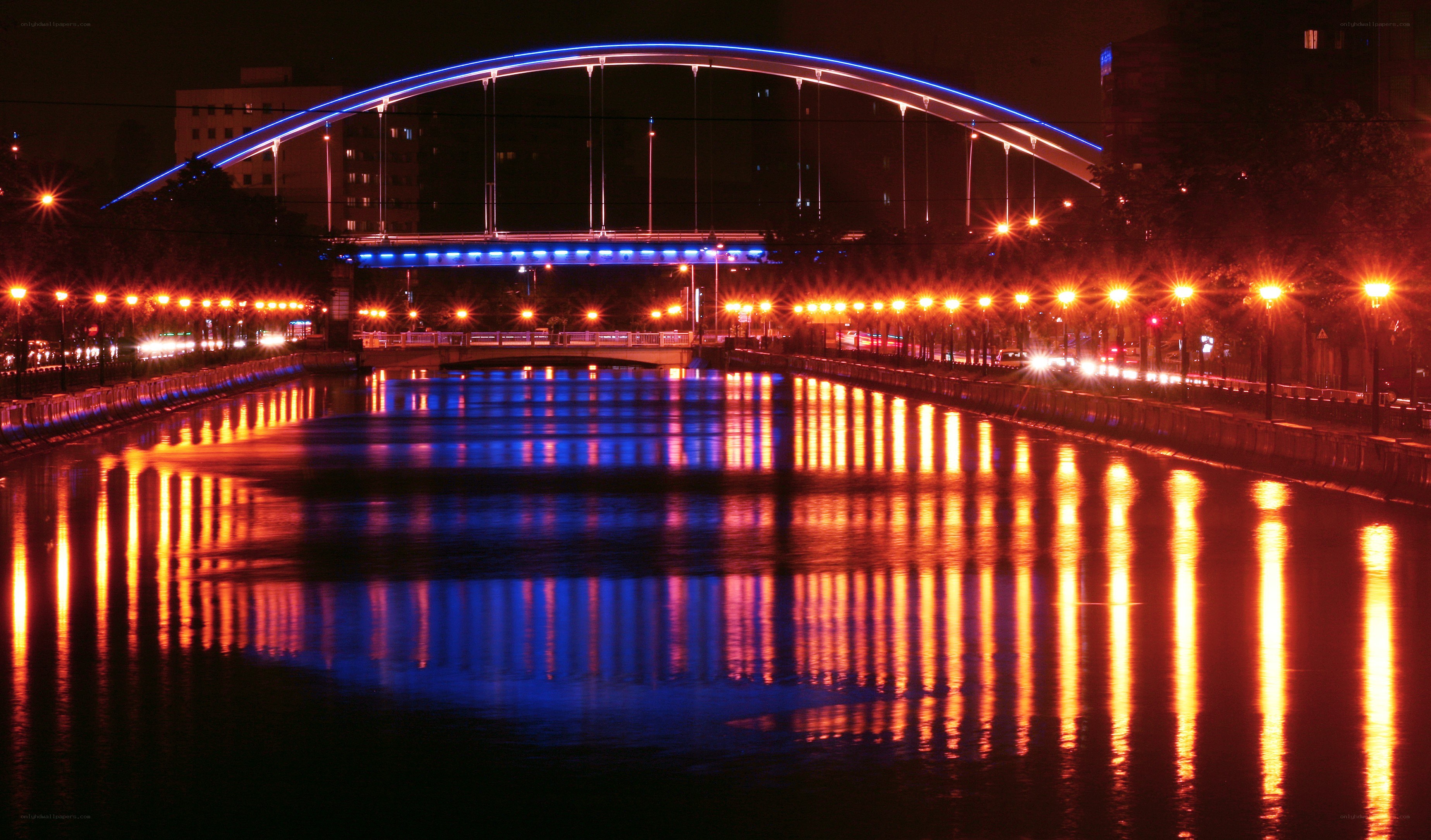 nighttime city bridge with lights
