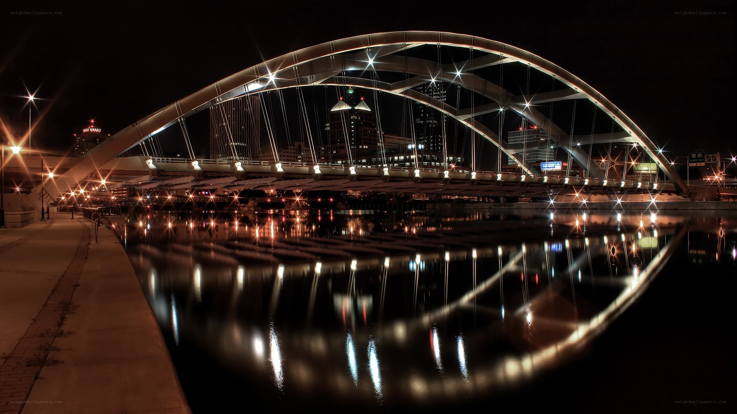 Nighttime city bridge with lights