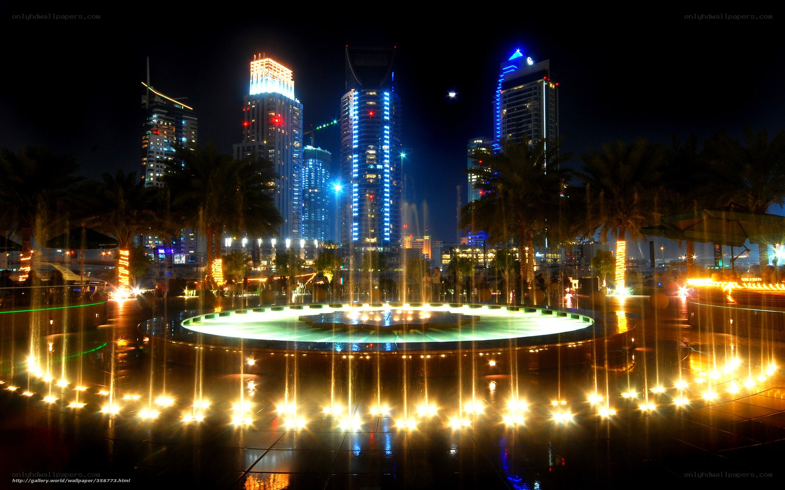 Nighttime city fountain scene