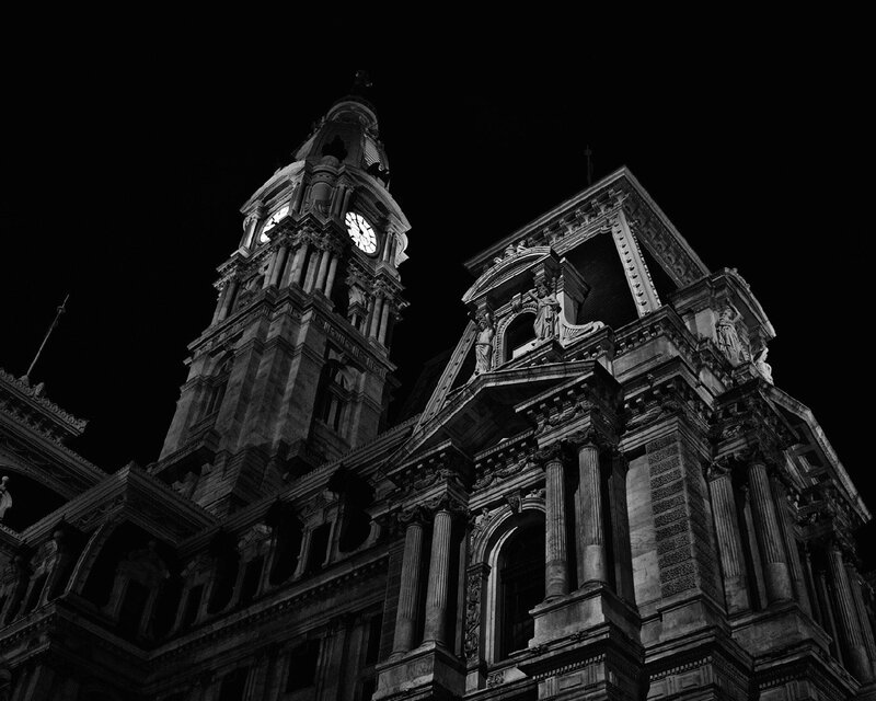 nighttime city hall clock tower