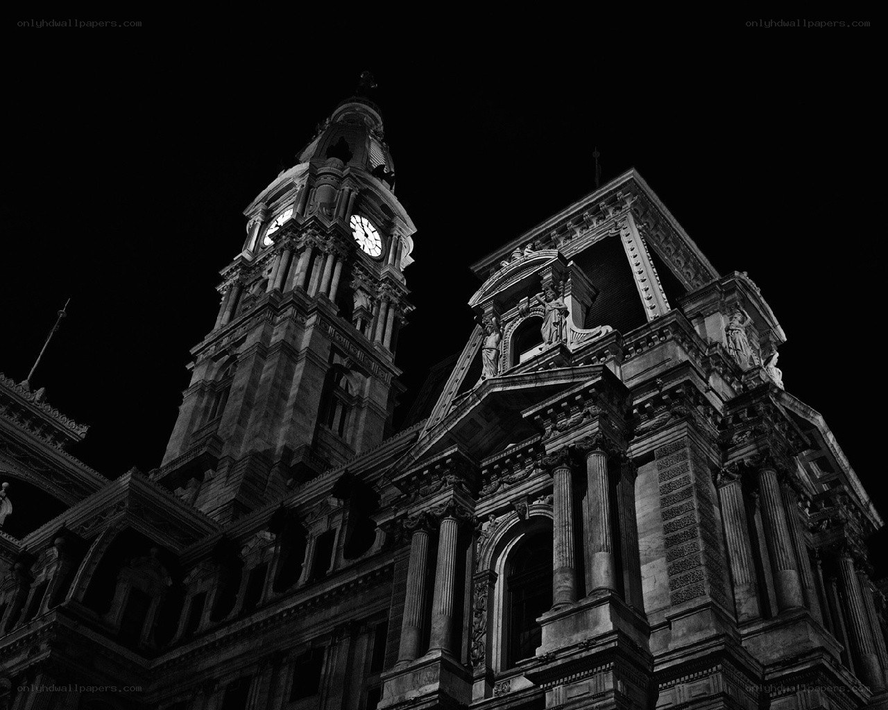 nighttime city hall clock tower
