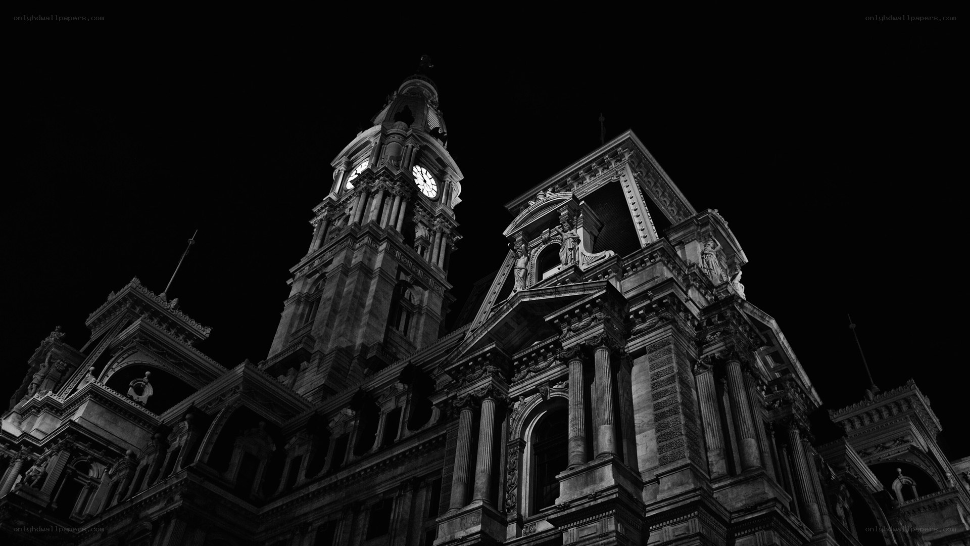 nighttime city hall clock tower