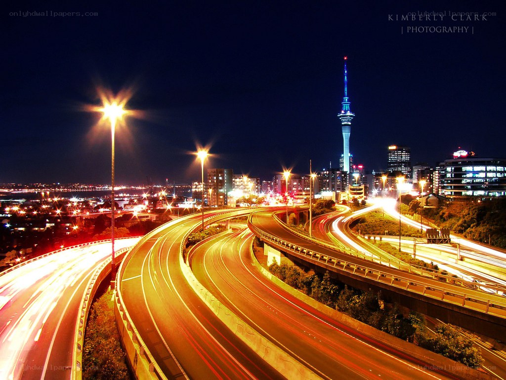 Nighttime city highway and tower