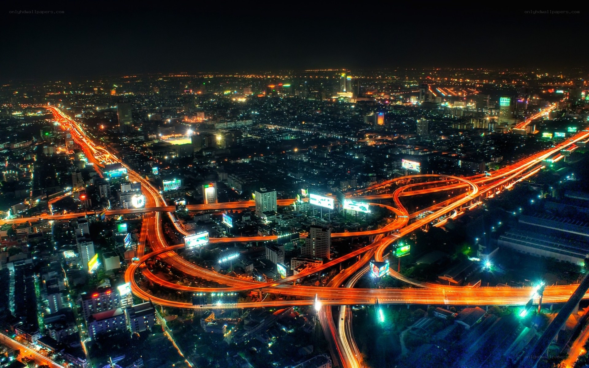 nighttime city highway interchange