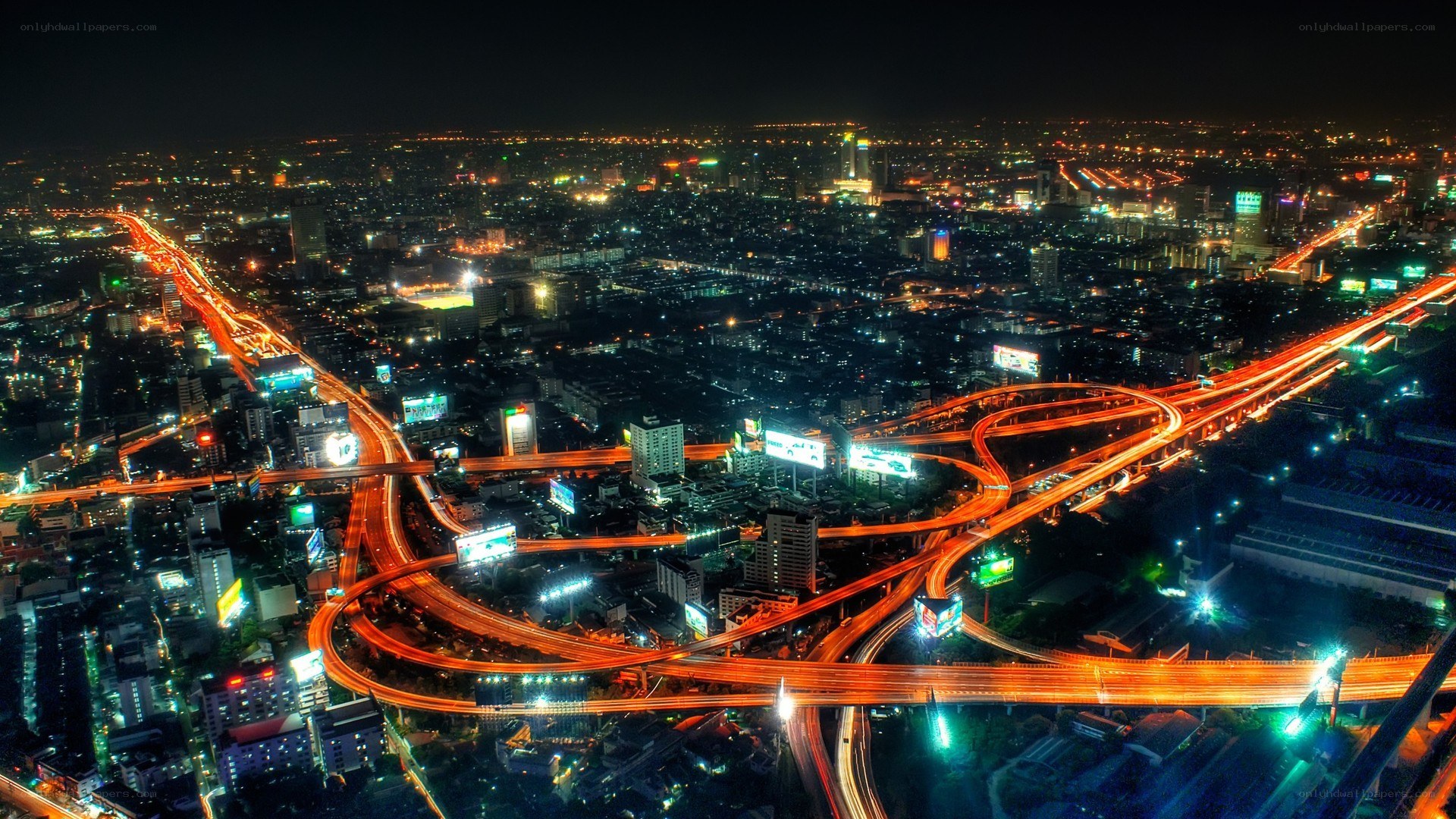 nighttime city highway interchange