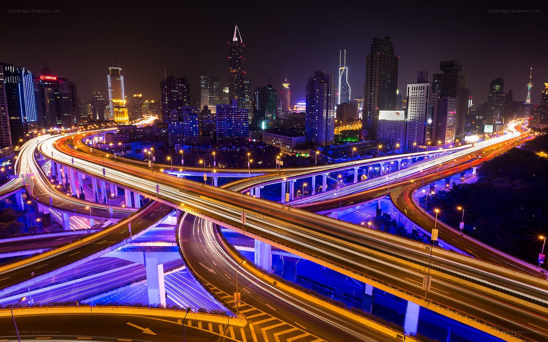 nighttime city highway interchange