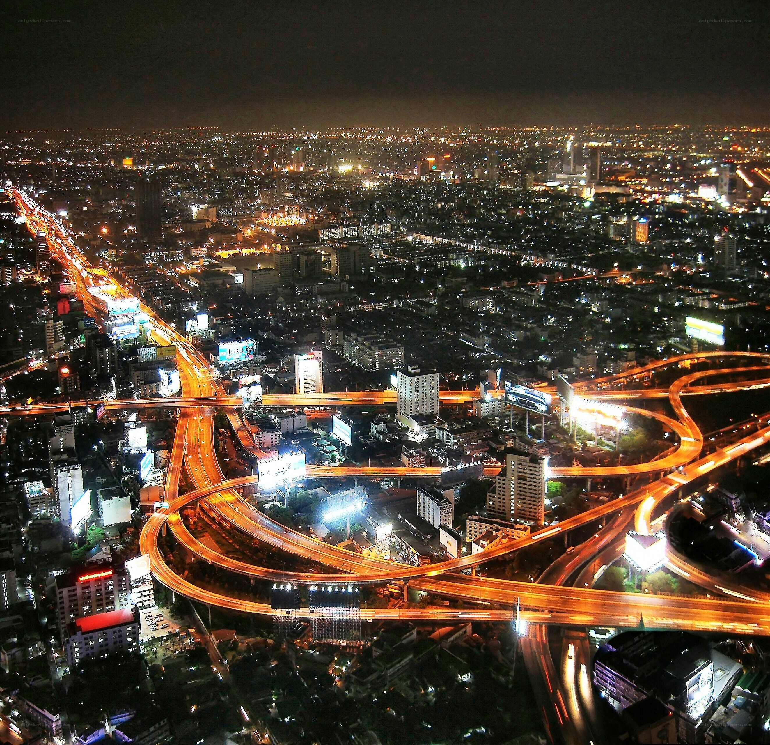 nighttime city highway interchange