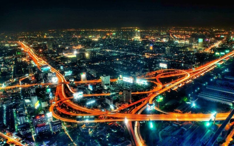 Nighttime City Highway Interchange — Orange
