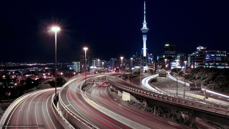 Nighttime city highway with tower