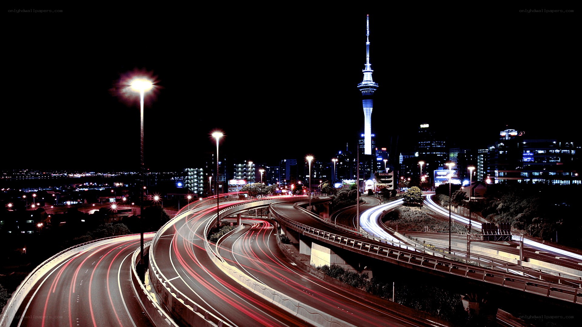 Nighttime city highway with tower