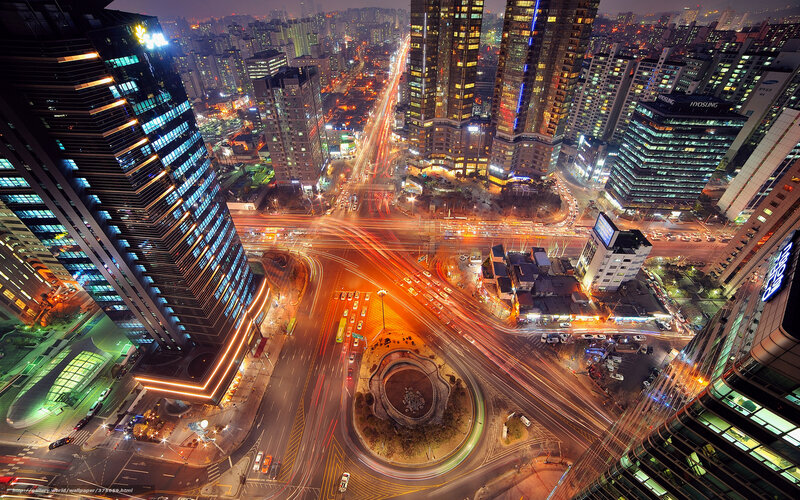 Nighttime City Intersection — Orange