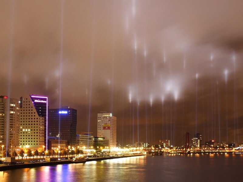Nighttime city lights and fountains