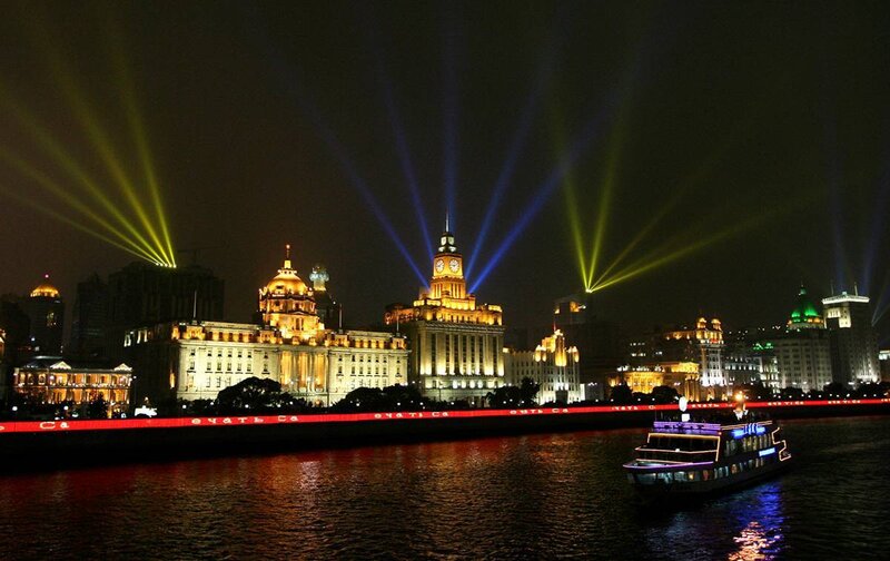 nighttime city lights and river cruise