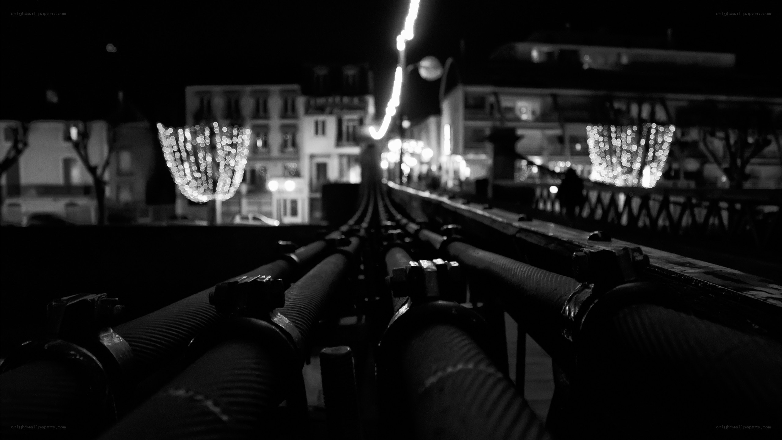 Nighttime city lights from a bridge