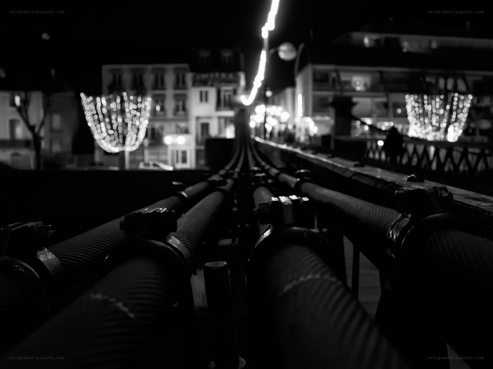 nighttime city lights from bridge