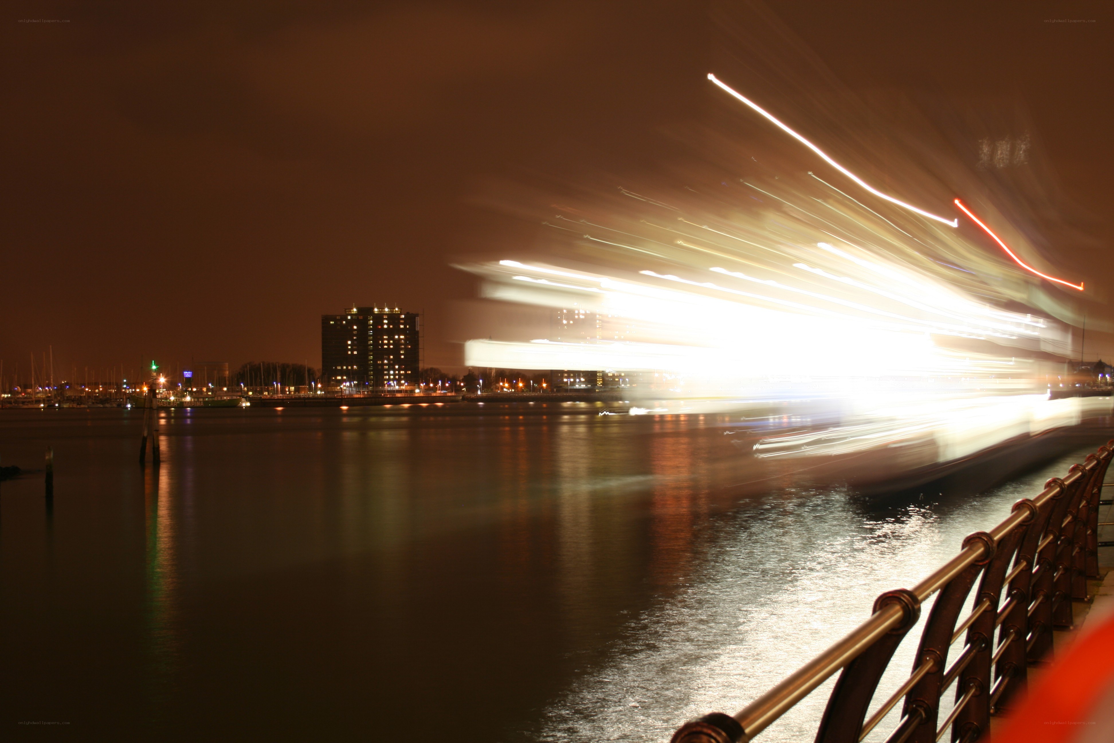nighttime city lights on water
