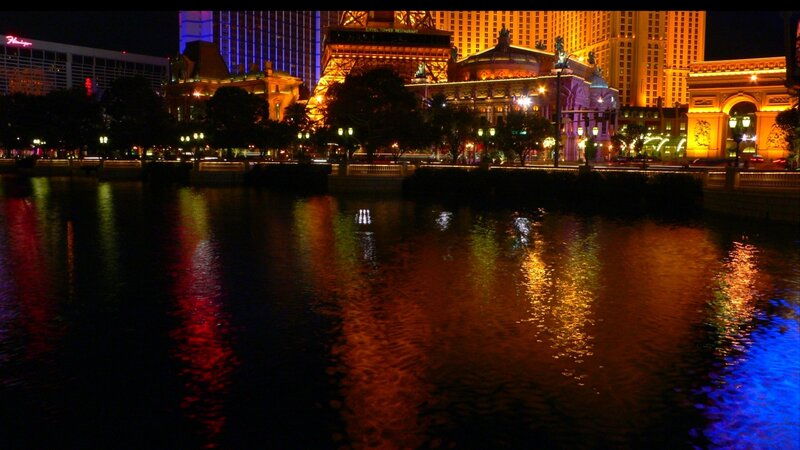 nighttime city lights reflection