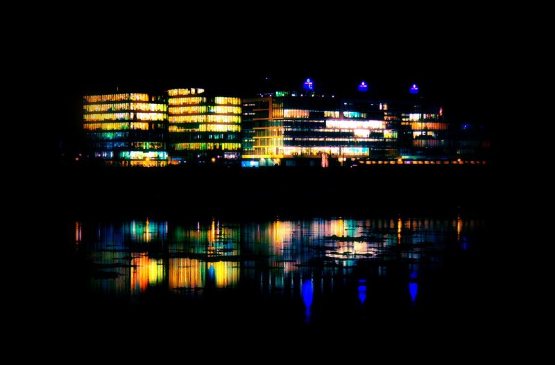 nighttime city lights reflection