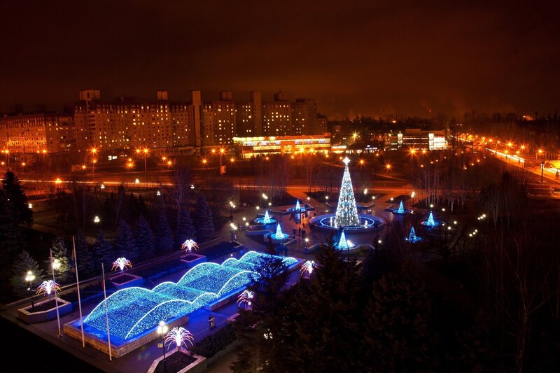 Nighttime city park with Christmas lights