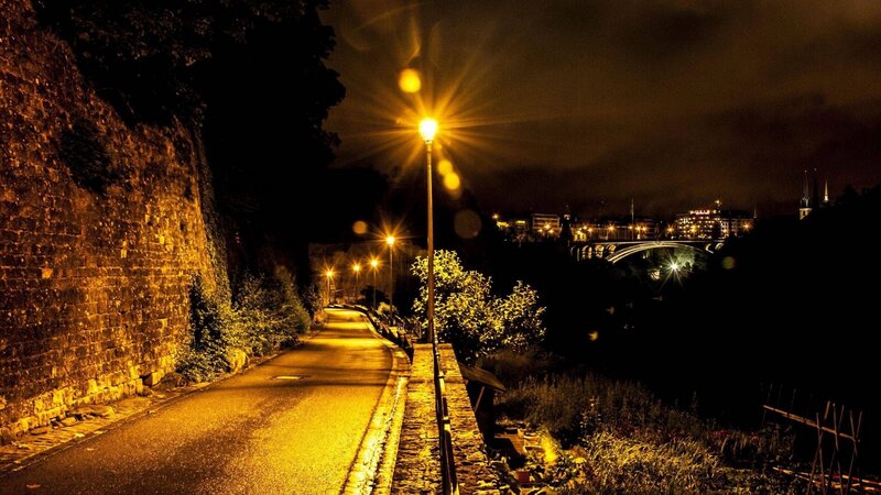 nighttime city path with bridge