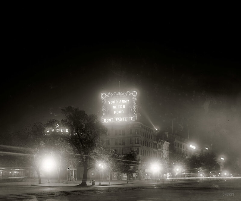 Nighttime city scene with billboard