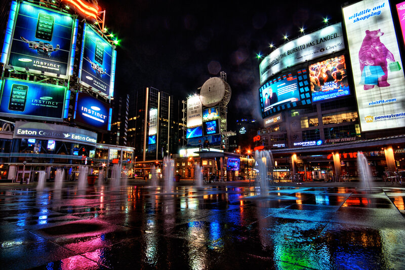 nighttime city scene with billboards