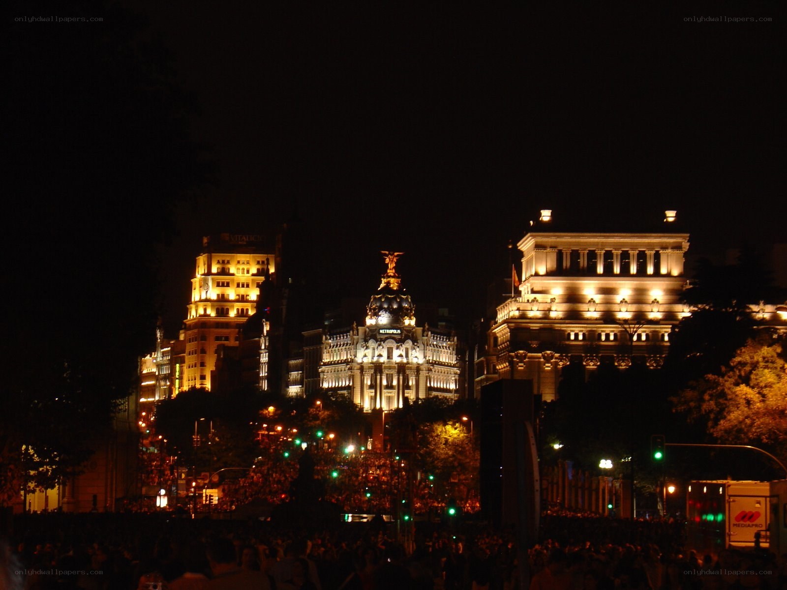 nighttime city scene with crowd