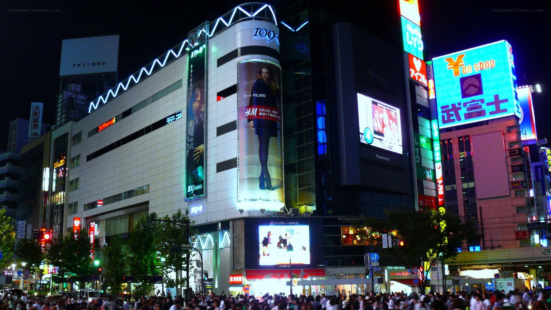 Nighttime city scene with crowds