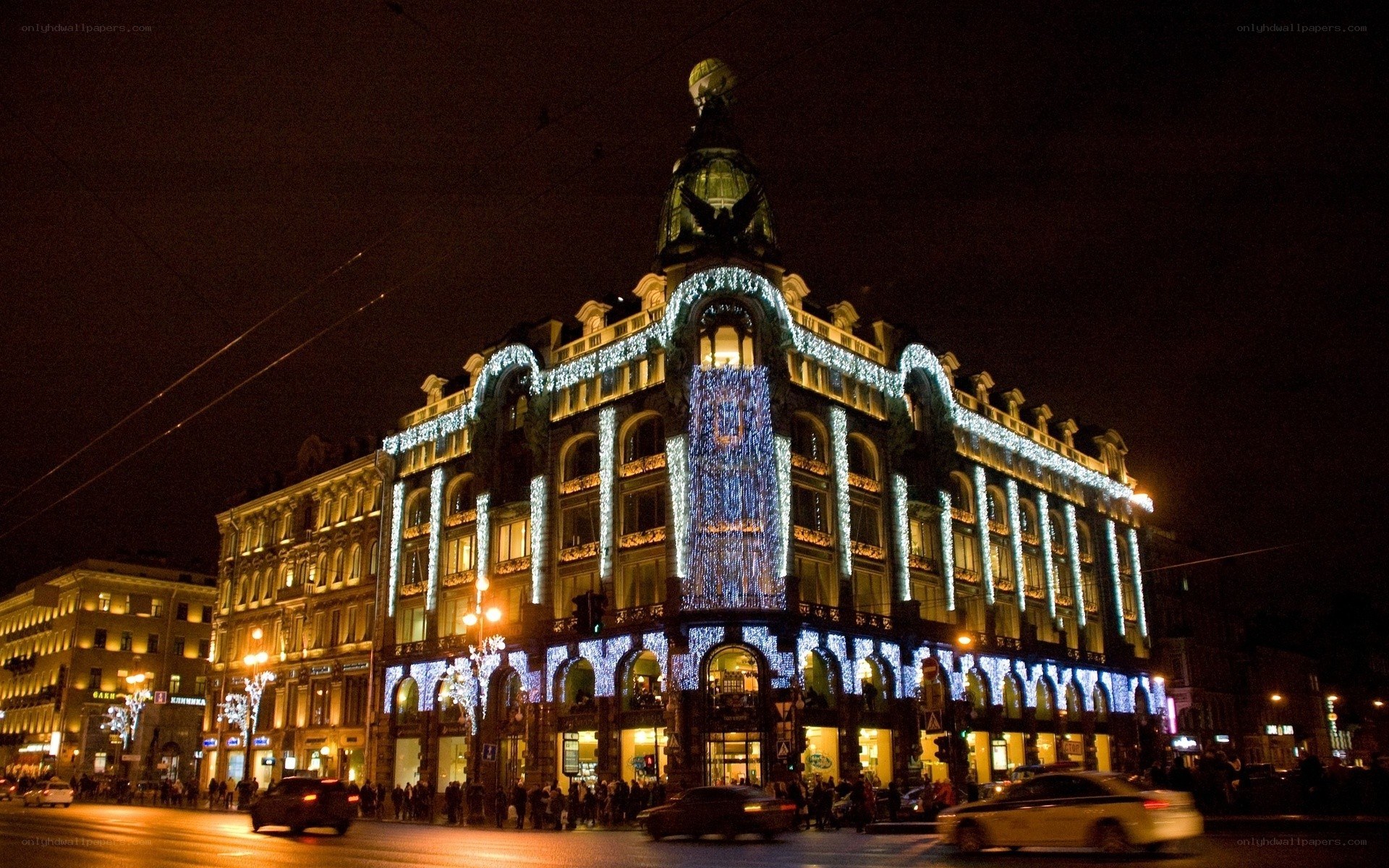 Nighttime city scene with lit building